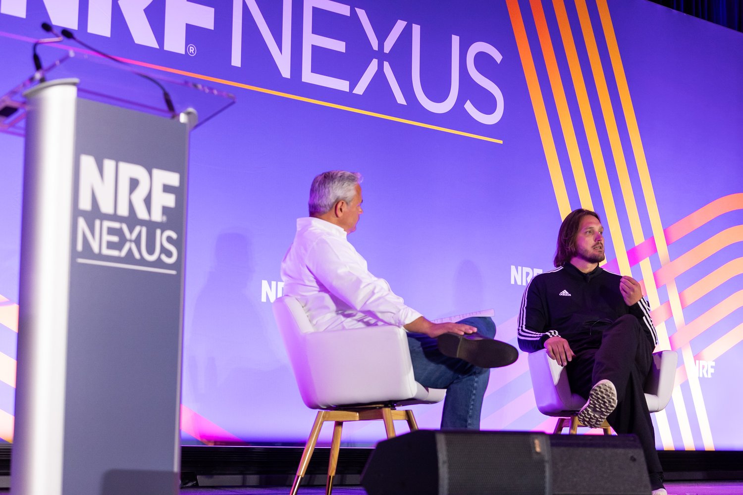 Mark Cibort (Reaktor) and Constantine Gavrykov (adidas) on a stage of NRF Nexus 2023