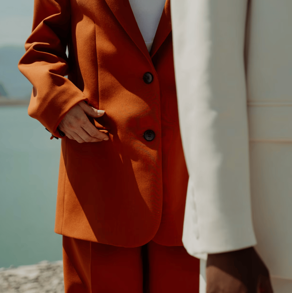 a close of of two people in suits